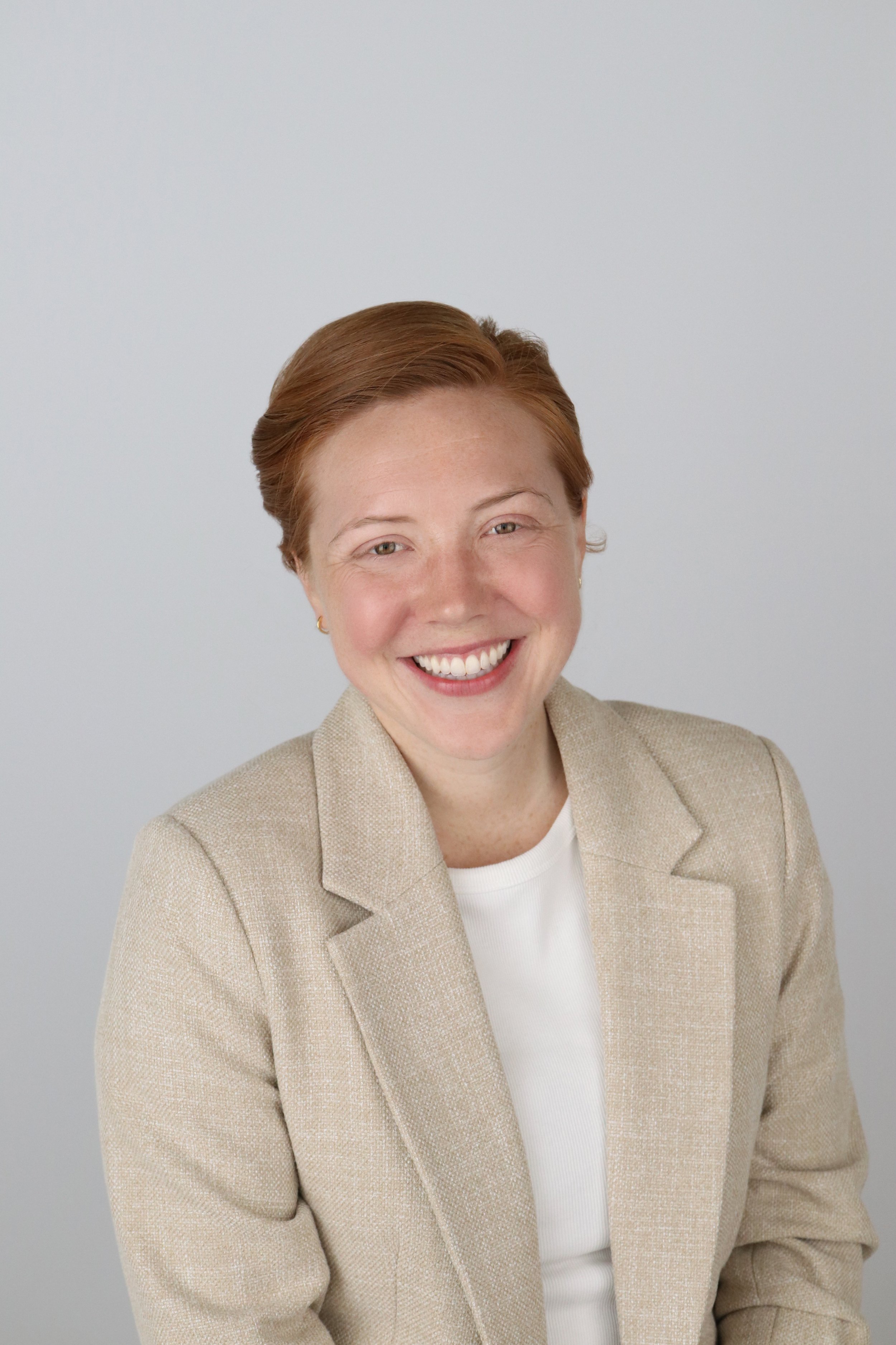 Woman's Headshot in a Short Red Hair